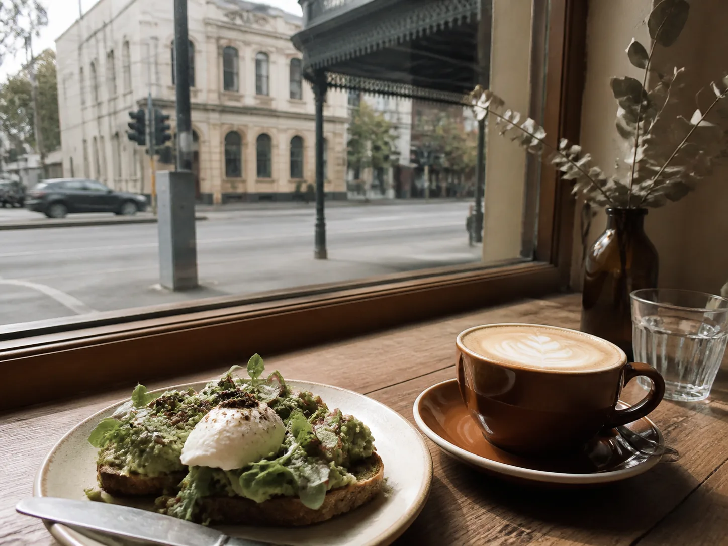 Flat white and brunch at a window table in South Melbourne