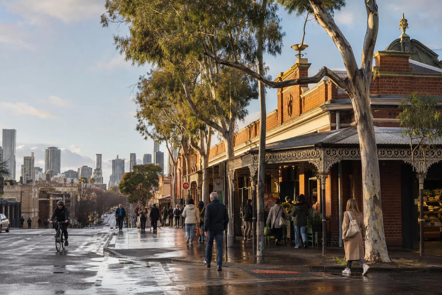 Heritage market streetscape and local pedestrians in South Melbourne after rain